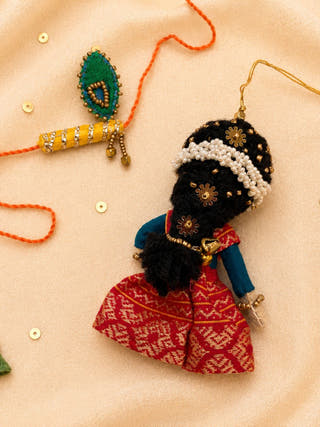 Radha Bansuri Rakhi Lumba Set | Set Of 2 | Red Weave & Yellow