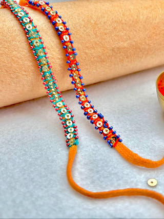 Hand Embroidered Blanket Stitch Rakhi | Set Of 2 | Sea Green & Red