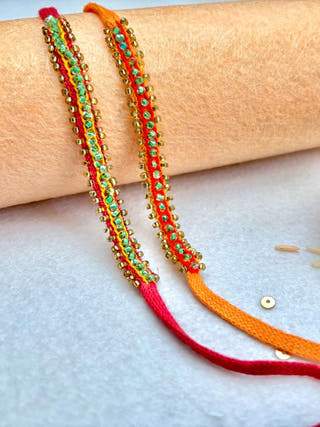 Hand Embroidered Beaded Chain Rakhi | Set Of 2 | Yellow & Red