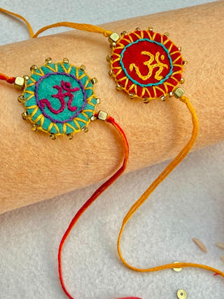 Hand Embroidered Aum Mandala Rakhi | Set Of 2 | Sea Green & Red