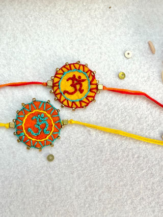 Hand Embroidered Aum Mandala Rakhi | Set Of 2 | Orange & Yellow