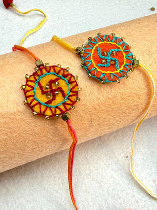 Hand Embroidered Swastika Mandala Rakhi | Set Of 2 | Yellow & Orange