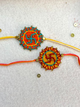 Hand Embroidered Swastika Mandala Rakhi | Set Of 2 | Yellow & Orange