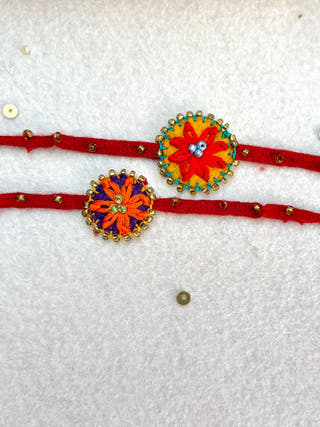 Hand Embroidered Flower Daisy Rakhi | Set Of 2 | Red & Orange