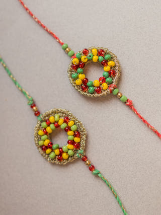 Rainbow Threads Crochet Rakhi (Set Of 2)