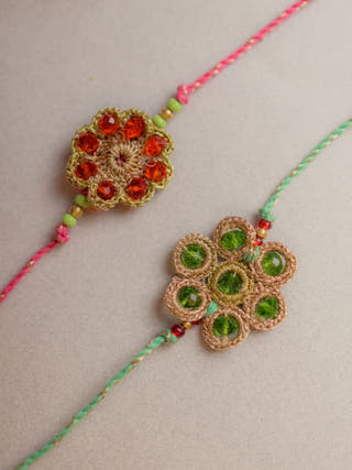 Jewelled Flowers Crochet Rakhi (Set Of 2)