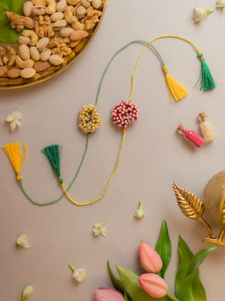Beaded Coral Crochet Rakhi (Set Of 2)