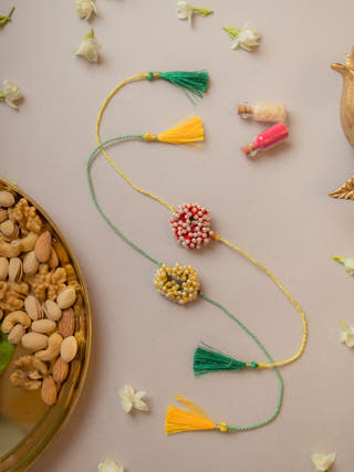 Beaded Coral Crochet Rakhi (Set Of 2)