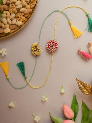 Beaded Coral Crochet Rakhi (Set Of 2)