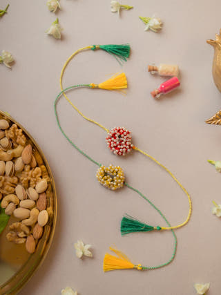 Beaded Coral Crochet Rakhi (Set Of 2)