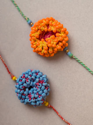 Coral Bead Crochet Rakhi (Set Of 2)