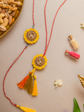 Marigold Crochet Rakhi & Lumba Set (Set Of 2)