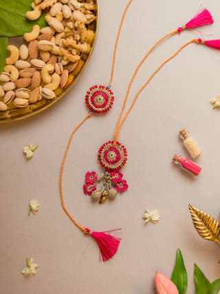 Pink Twilight Crochet Rakhi & Lumba Set (Set Of 2)