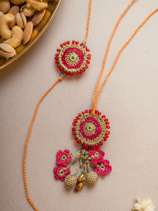 Pink Twilight Crochet Rakhi & Lumba Set (Set Of 2)