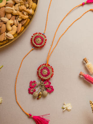 Pink Twilight Crochet Rakhi & Lumba Set (Set Of 2)