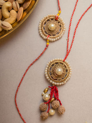 Antique Pearl Crochet Rakhi & Lumba Set (Set Of 2)