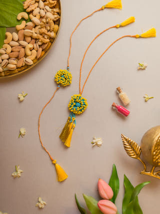 Yellow Coral Crochet Rakhi & Lumba Set (Set Of 2)