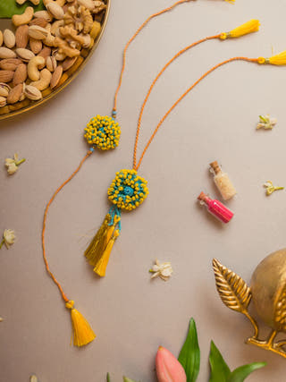 Yellow Coral Crochet Rakhi & Lumba Set (Set Of 2)