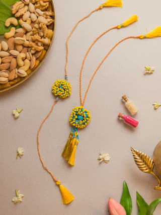 Yellow Coral Crochet Rakhi & Lumba Set (Set Of 2)