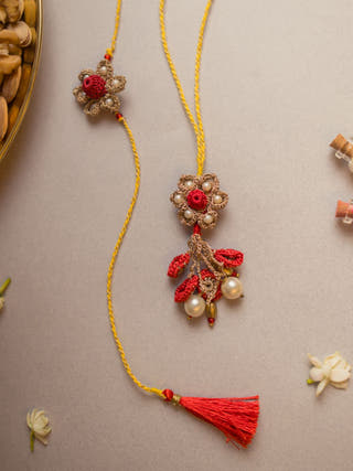 Antique Flower Crochet Rakhi & Lumba Set (Set Of 2)