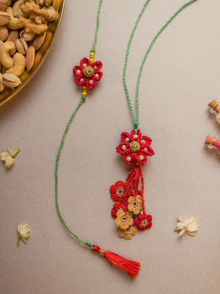 Red Flower Crochet Rakhi & Lumba Set (Set Of 2)