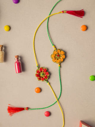 Festive Marigold Crochet Rakhi Set (Set Of 2)