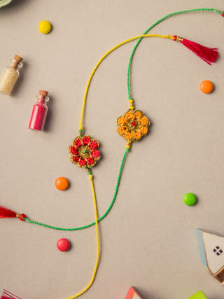 Festive Marigold Crochet Rakhi Set (Set Of 2)