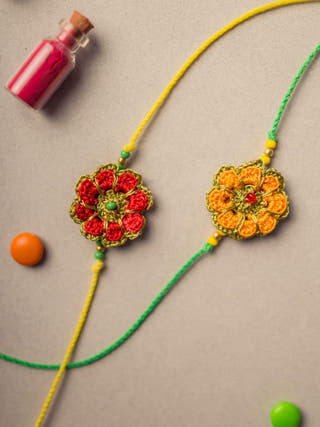 Festive Marigold Crochet Rakhi Set (Set Of 2)