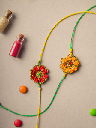 Festive Marigold Crochet Rakhi Set (Set Of 2)