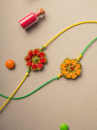Festive Marigold Crochet Rakhi Set (Set Of 2)
