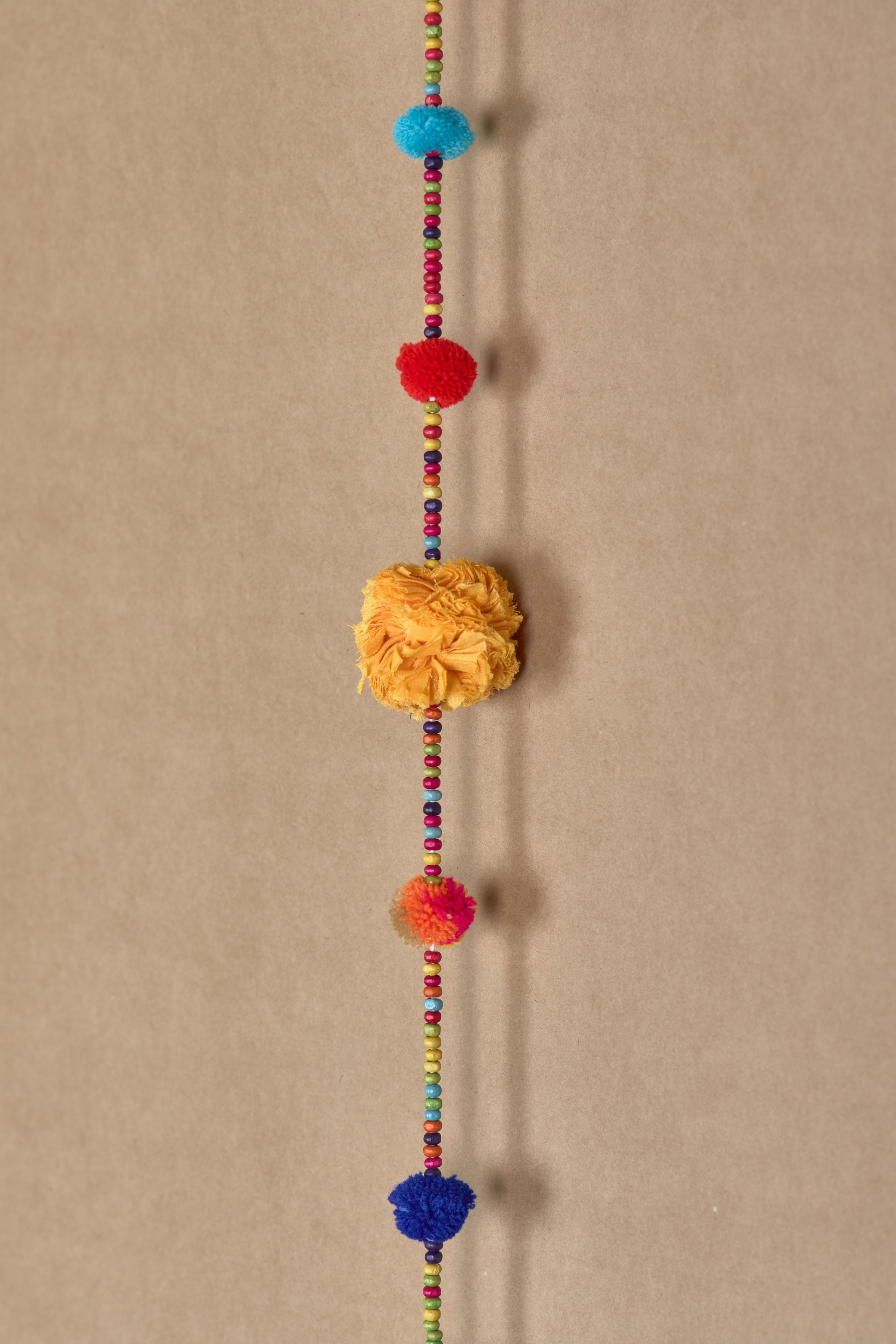 Chintzy Pom Pom string prop